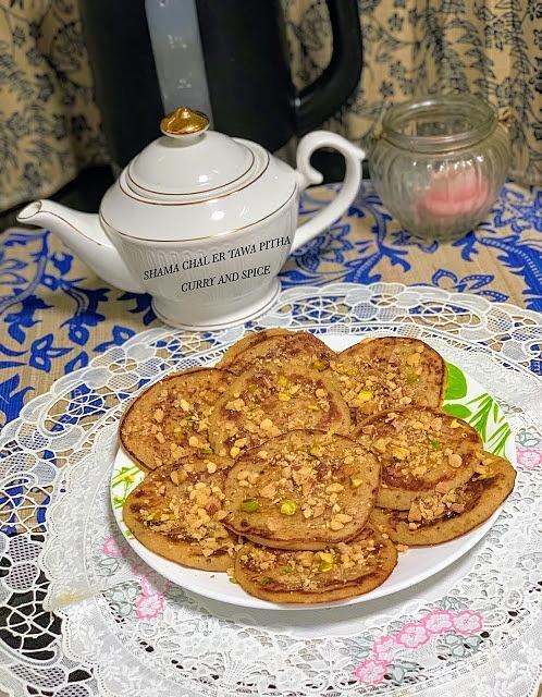 Shama chal er tawa pitha