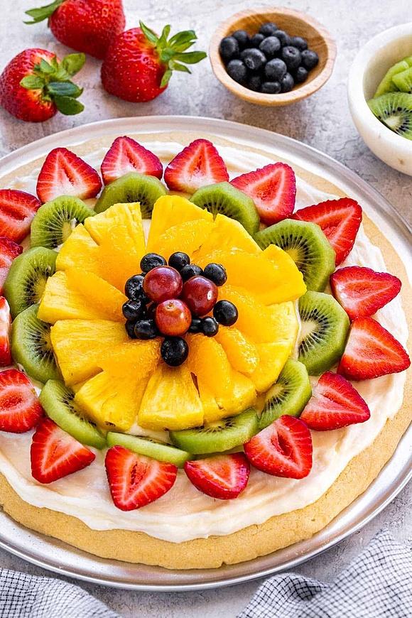 Fruit pizza with cookie crust and fresh fruit topping