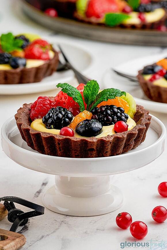 Fresh fruit tarts with chocolate shells