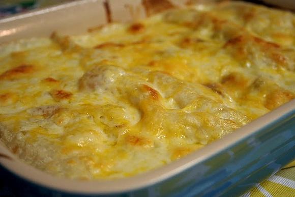 Chicken enchiladas with green chili sour cream sauce