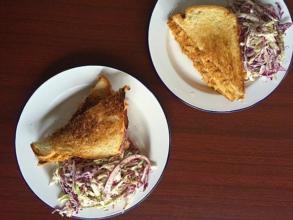 Bbq pulled chicken and cabbage slaw sandwich