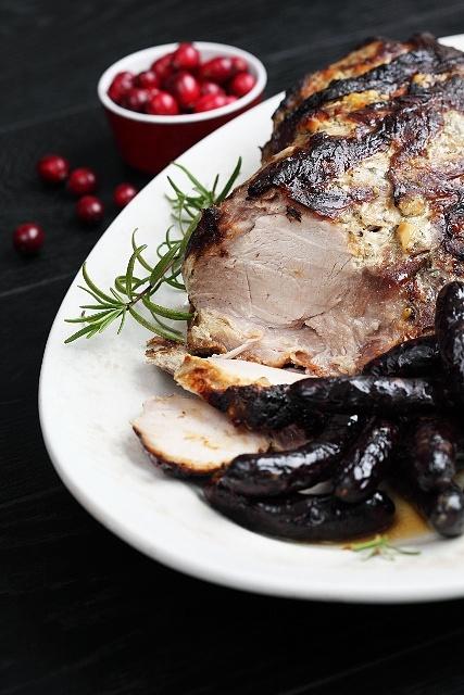 Traditional Christmas roast oven-baked pork shoulder with honey mustard and rosemary