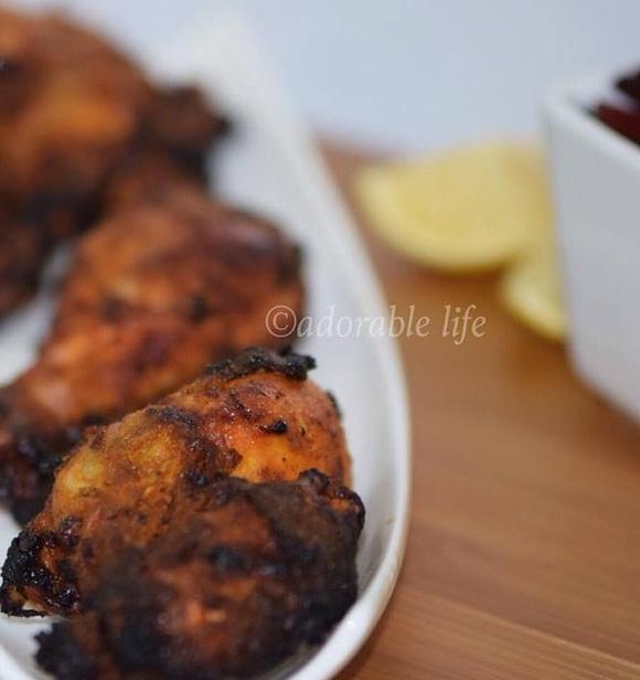 Homemade indian tandoori chicken on stove top grill pan
