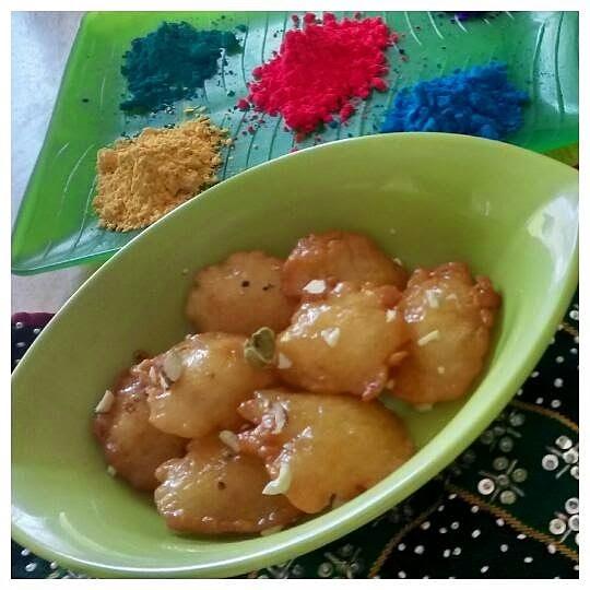 Malpua Indian dessert with sugar syrup and rabri