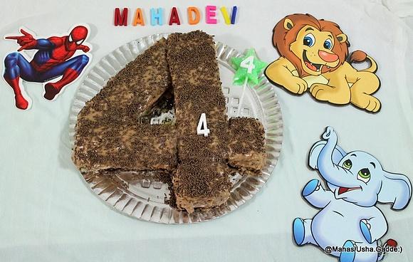 Number 4 shaped birthday cake with chocolate frosting and step-by-step photos