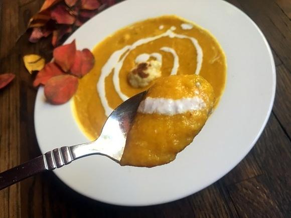 Vegan creamy roasted cauliflower and pumpkin soup with spicy red curry