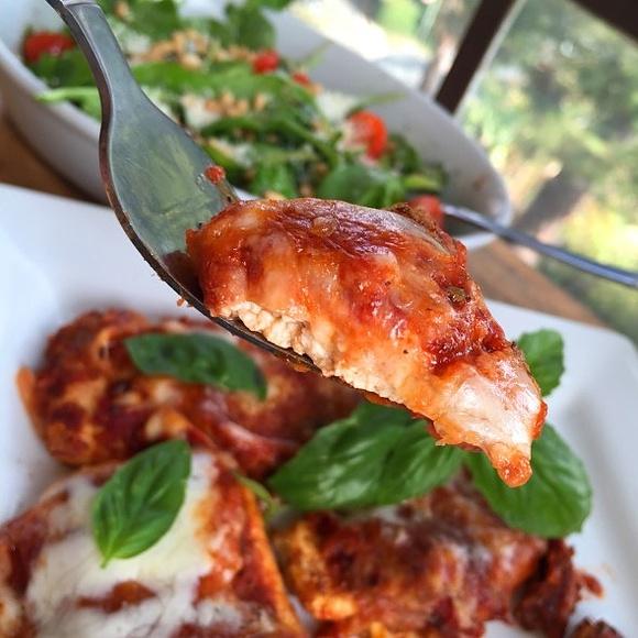 Vegetarian tofu parmigiana with arugula salad