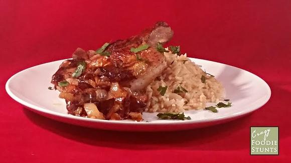 Pork chop with caramelized onions and cinnamon rice pilaf