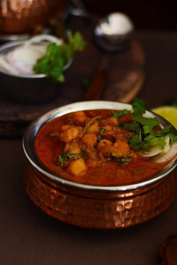 Chickpeas and mustard leaves curry with east indian bottle masala