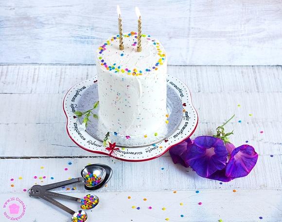 Two years of lil cupcake monkey pink ombre cake with confetti buttercream frosting