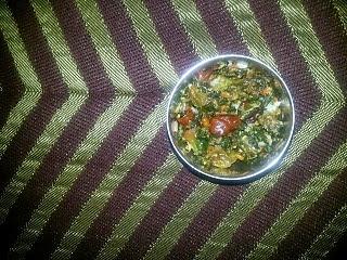 Red spinach curry with bright red and green leaves