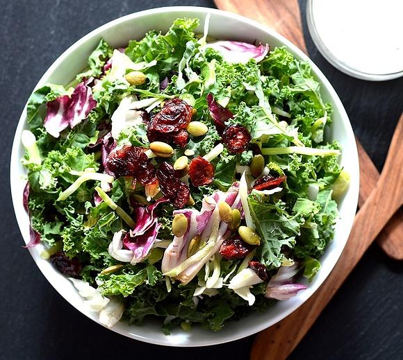 Best detox salad with kale, cranberries, pumpkin seeds and brussels sprouts