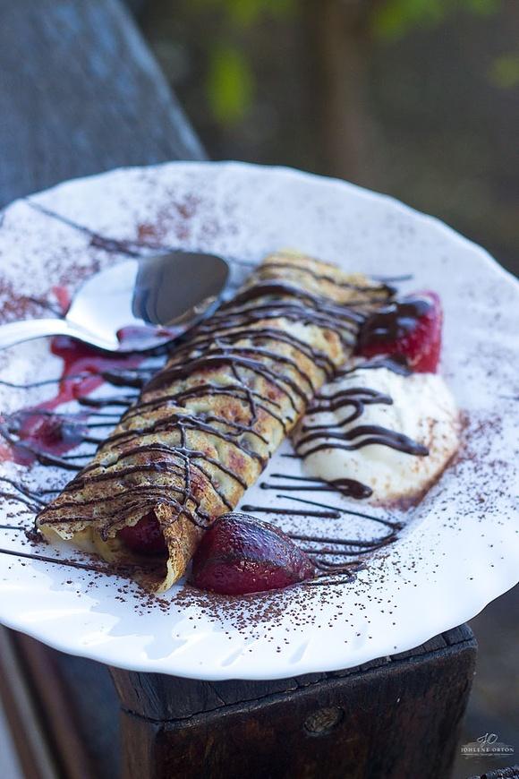 Healthy pancake filling with dark chocolate and strawberries