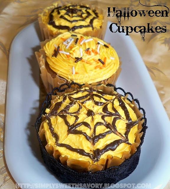 Halloween cupcakes with orange buttercream and chocolate